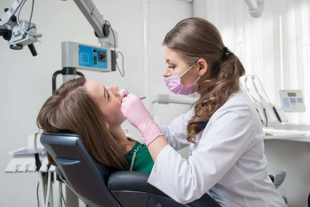 Female-Dentist-With-Dental-Tool - Kent Dentist